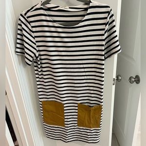 Black and white striped dress with tan faux leather pockets. So stylish!